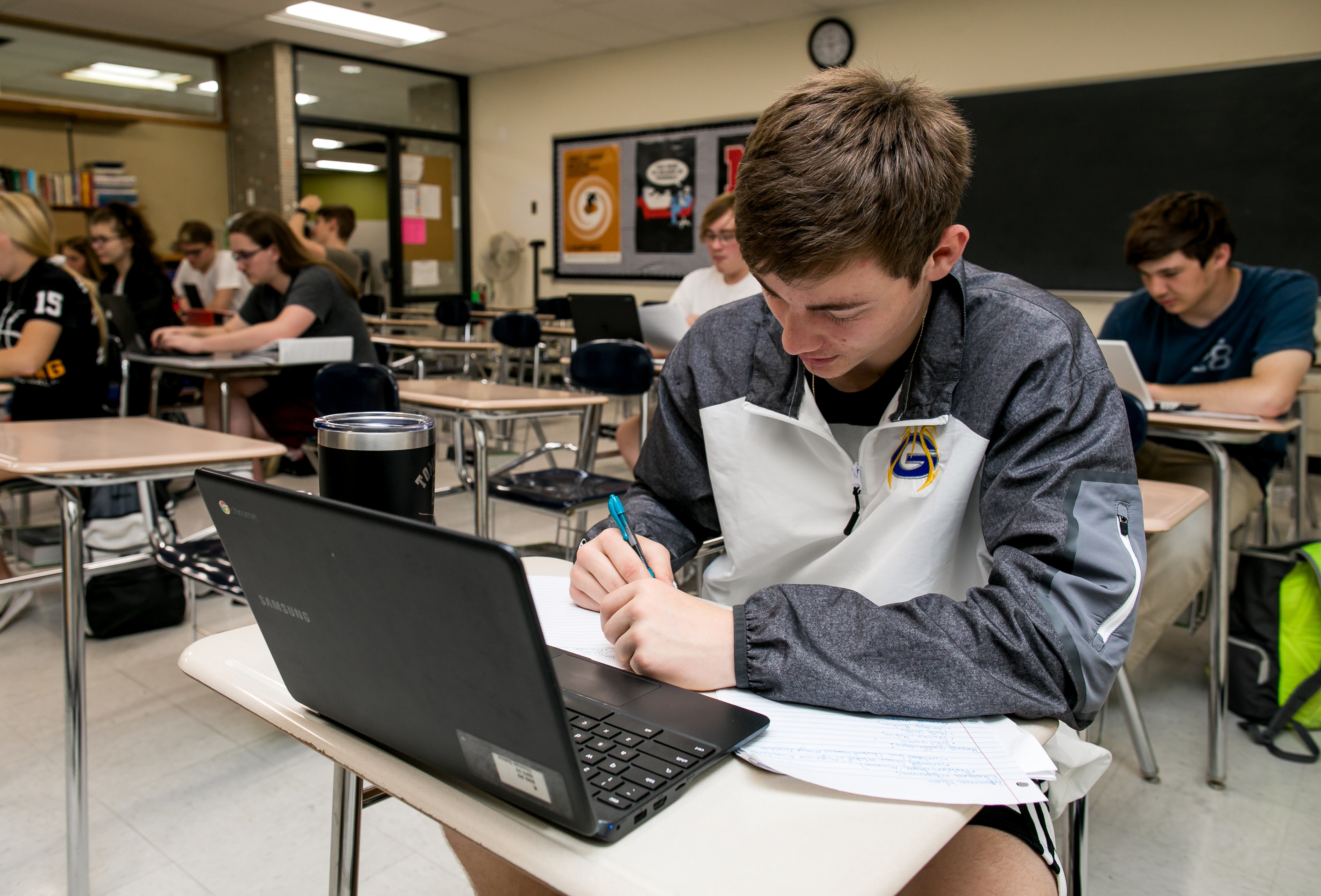 A dual credit student studying in classroom.